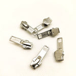 Cursores automáticos para cremallera metálica modelo YKK.